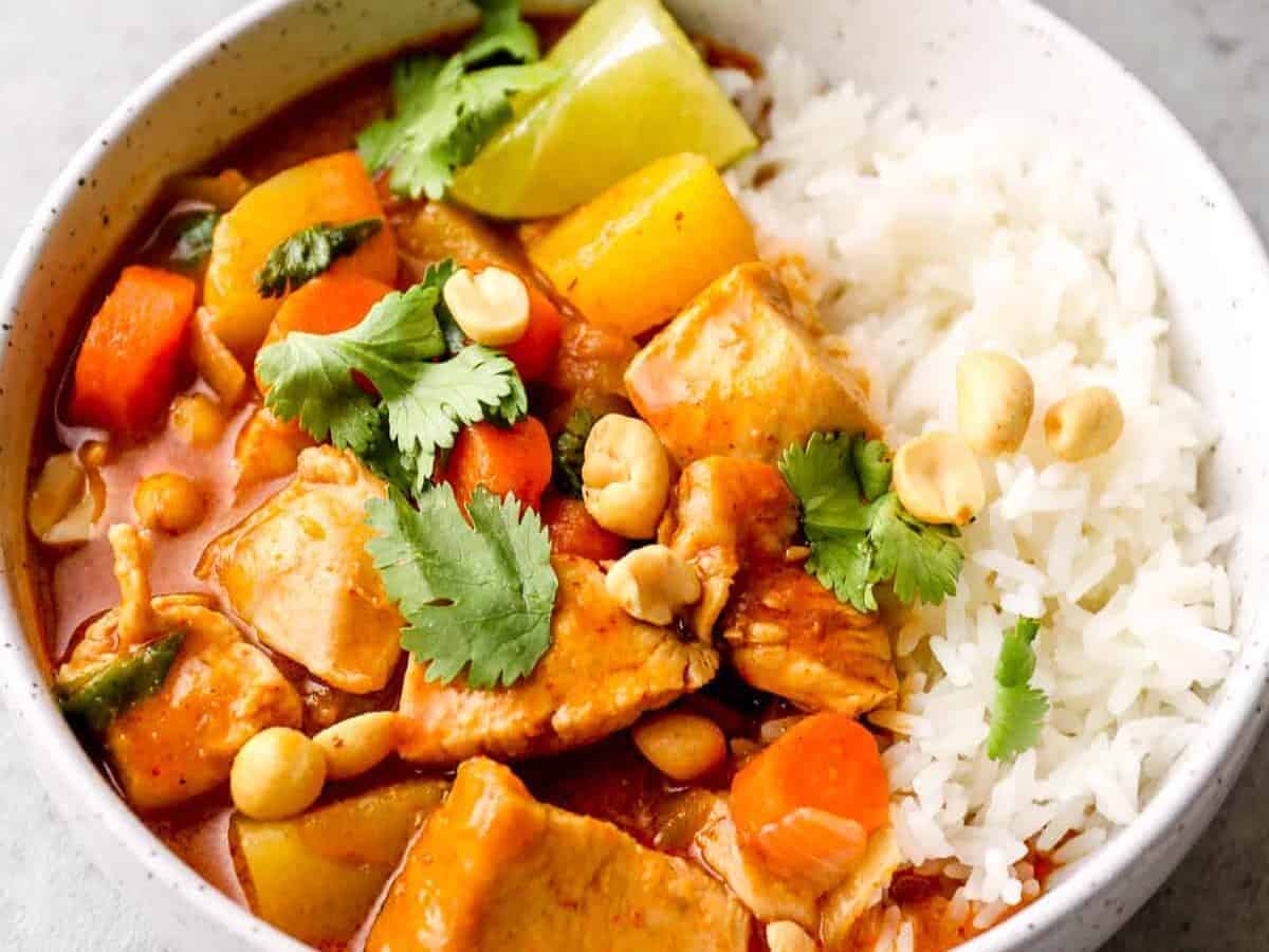 side image of massaman curry garnished with peanuts