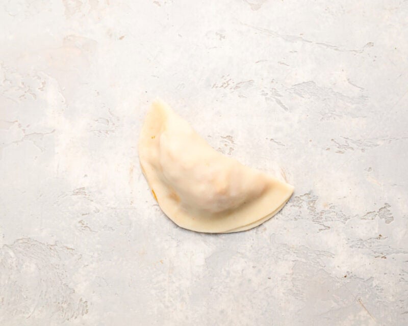 an empanada folded into a half-moon.