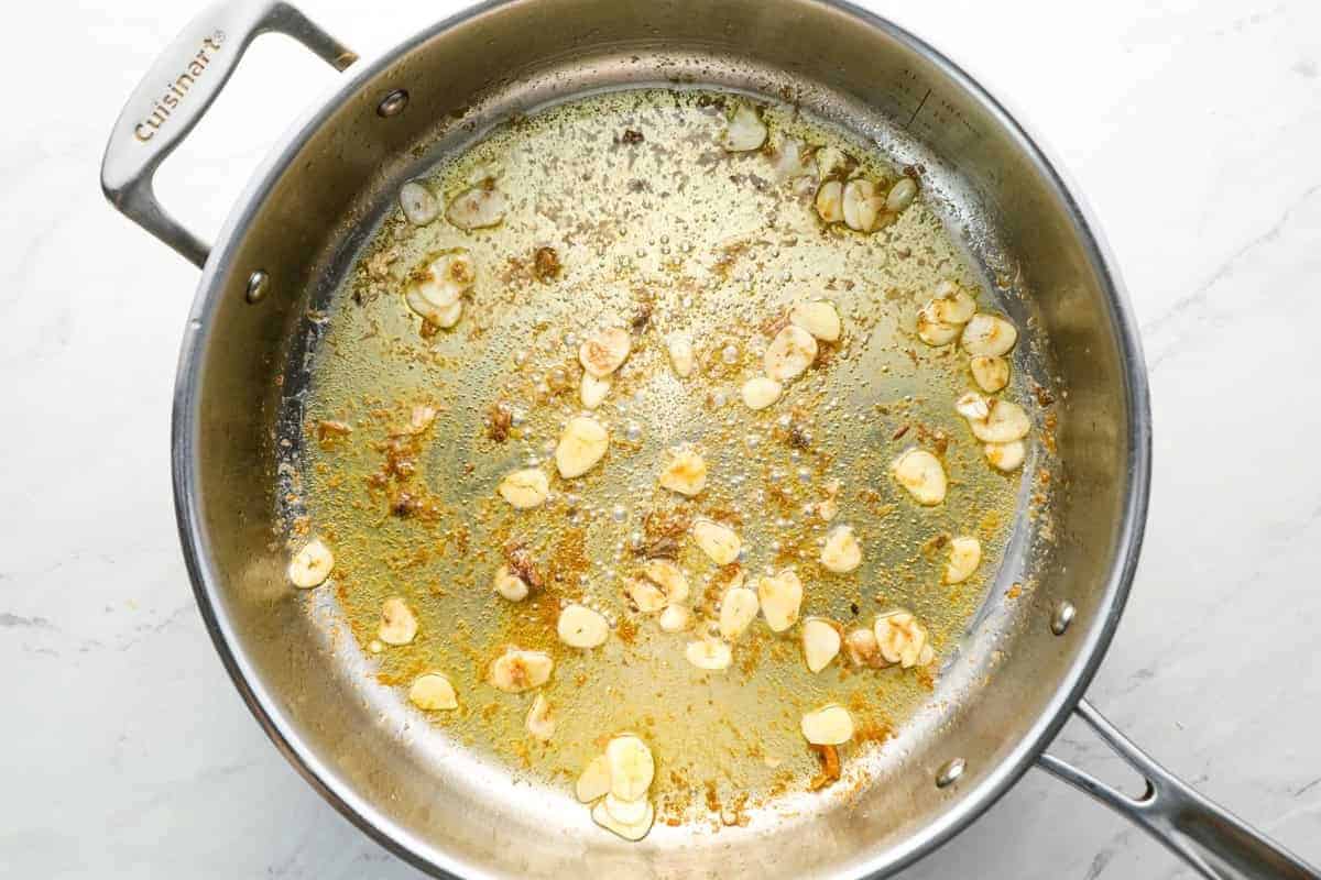 sautéed garlic and anchovy paste in a sauté pan.