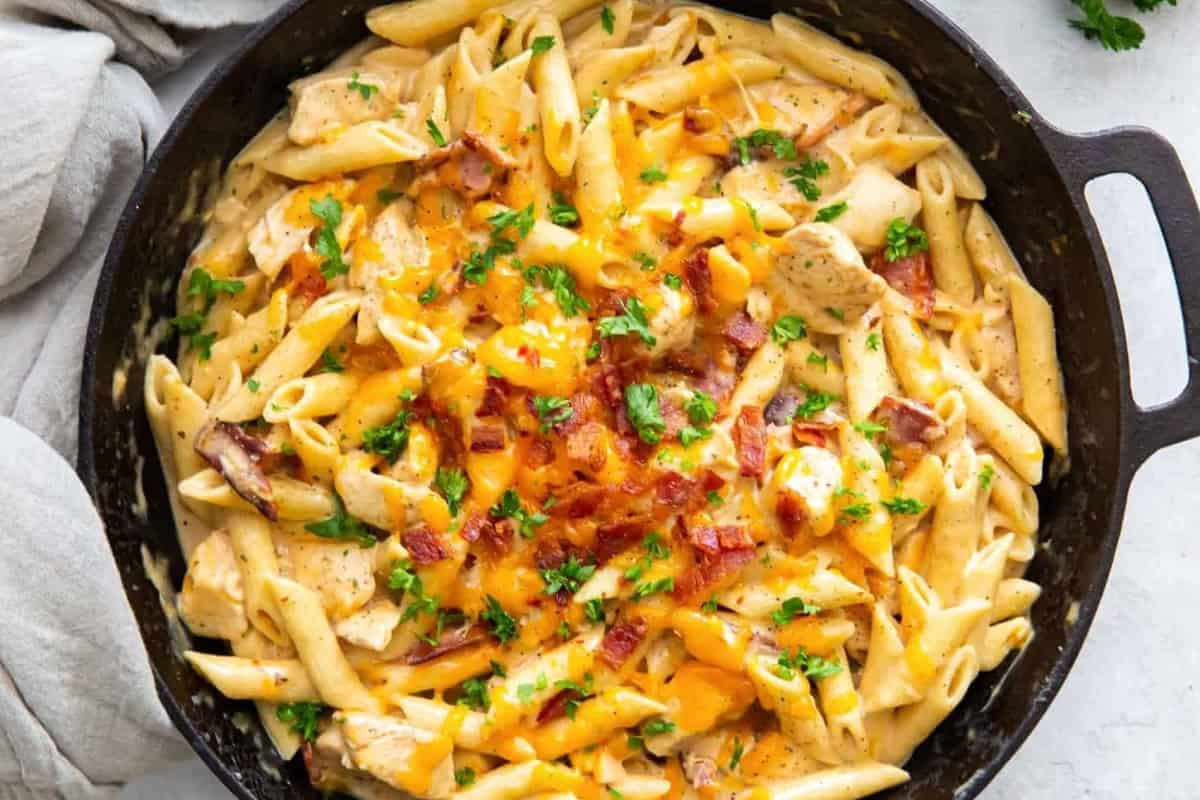 Crack chicken pasta in a skillet.