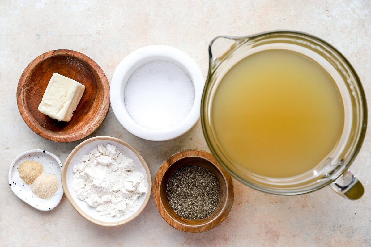measured ingredients for chicken gravy in individual bowls.