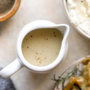 overhead view of chicken gravy in a gravy pitcher.