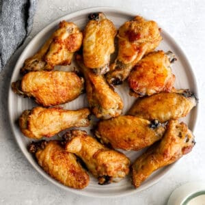 cooked chicken wing pieces on a plate.