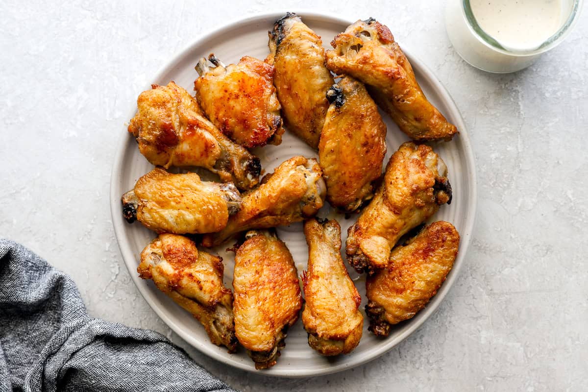 cooked chicken wing pieces on a plate.