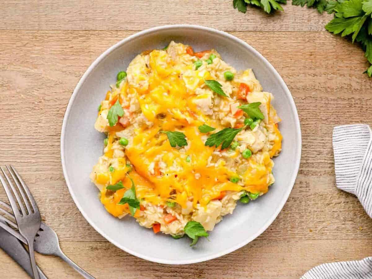 serving of crockpot chicken and rice casserole on a white plate.