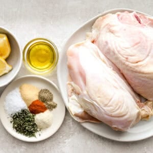 portioned ingredients for baked bone in chicken breasts in individual containers.
