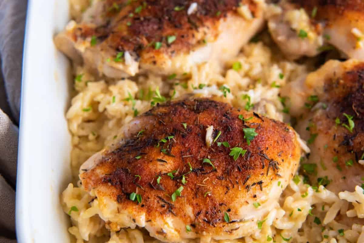 Baked chicken and rice in a casserole dish.