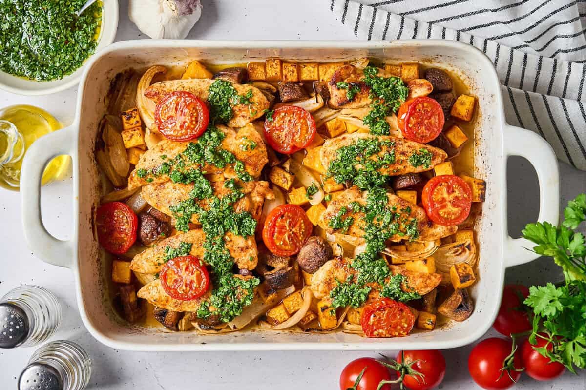 Baked chicken tenders and veggies topped with hot honey chimichurri sauce.