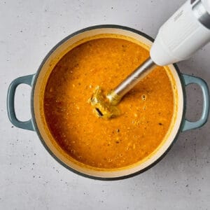 chicken mulligatawny soup in a dutch oven after blending with an immersion blender.