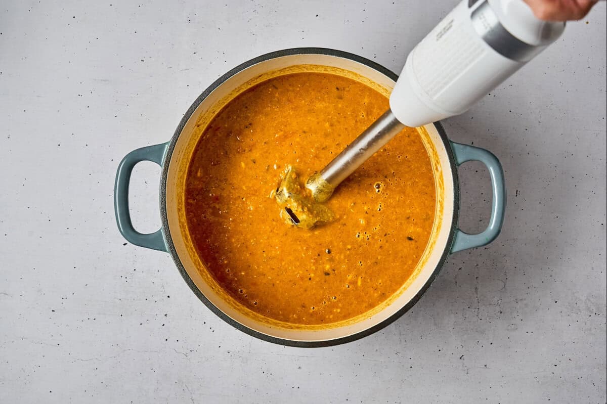 chicken mulligatawny soup in a dutch oven after blending with an immersion blender.