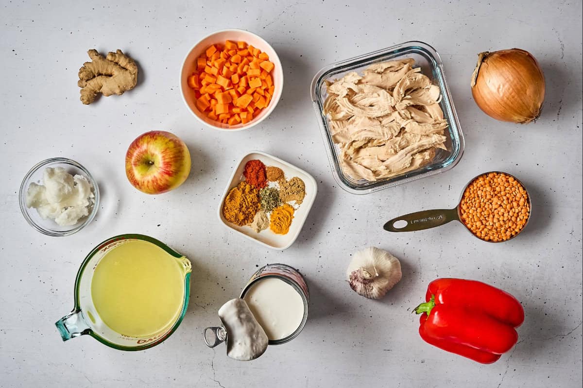 portioned ingredients for chicken mulligatawny soup in individual containers.