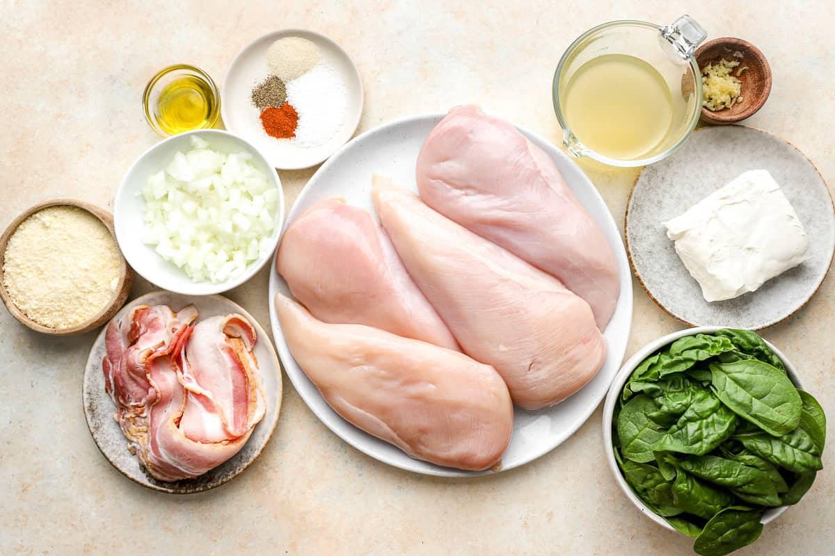 portioned ingredients for chicken roulade on individual plates.