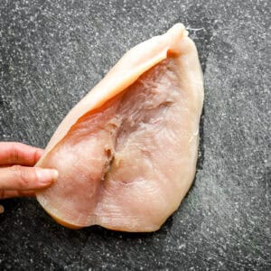 opening a butterflied chicken breast.