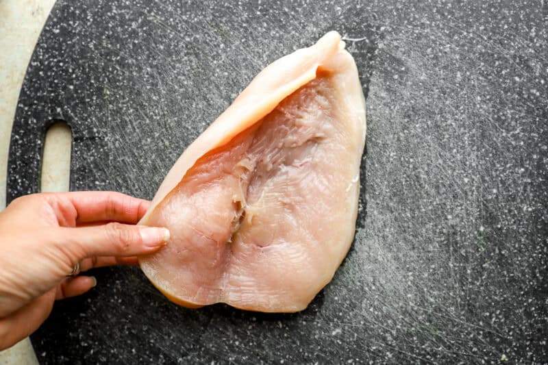 opening a butterflied chicken breast.