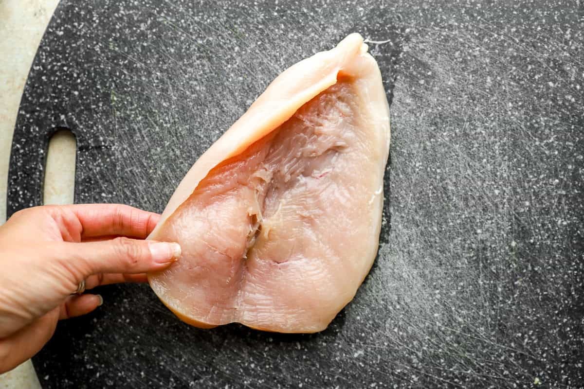 opening a butterflied chicken breast.