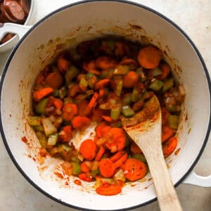 sauteeing veggies in a pot.