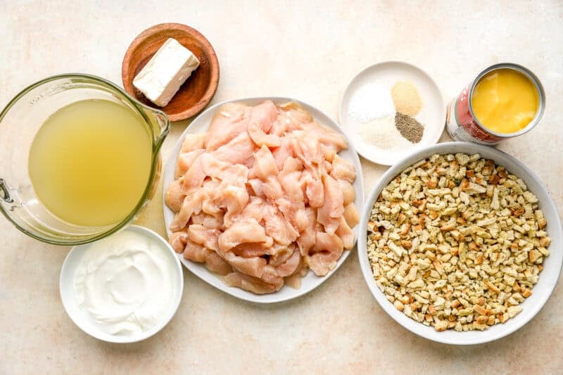 portioned ingredients for chicken and stuffing casserole in individual bowls.