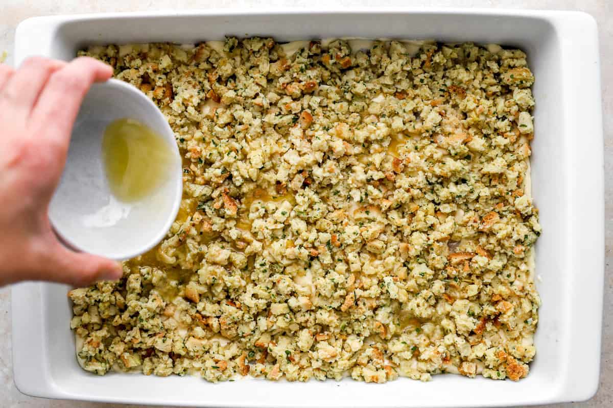 drizzling melted butter over chicken stuffing casserole in a baking dish before baking.