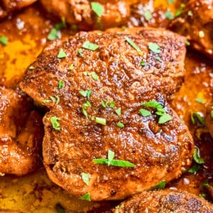 closeup of chipotle orange chicken thighs with cilantro.