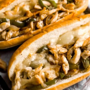 chicken cheesesteaks on a baking sheet.