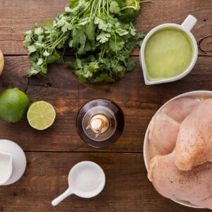 overhead view of measured ingredients for creamy cilantro lime chicken in individual bowls.