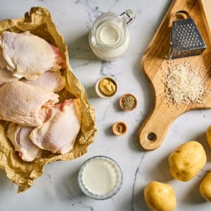portioned ingredients for chicken thighs and potatoes dauphinoise.