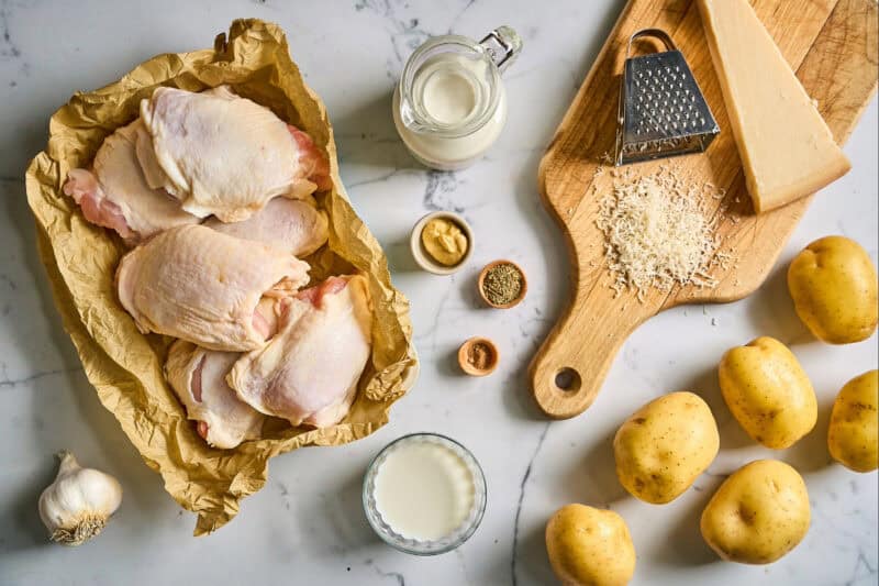 portioned ingredients for chicken thighs and potatoes dauphinoise.