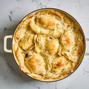 chicken thighs and potatoes dauphinoise mid-bake.