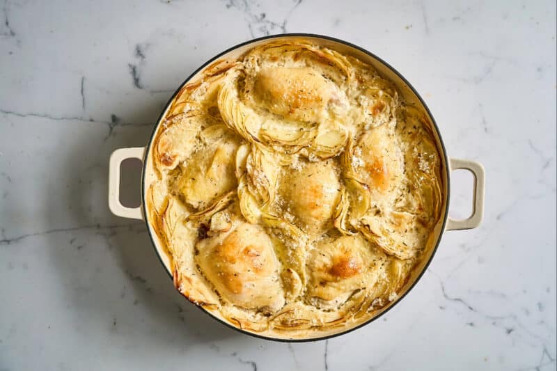 chicken thighs and potatoes dauphinoise mid-bake.