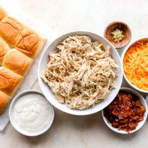 portioned ingredients for chicken bacon ranch sliders in individual containers.