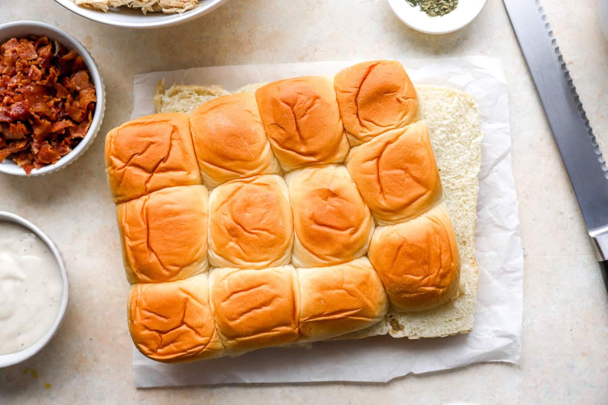 Hawaiian rolls cut in half horizontally.