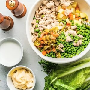 Chicken, potatoes, and veggies combined in a bowl.