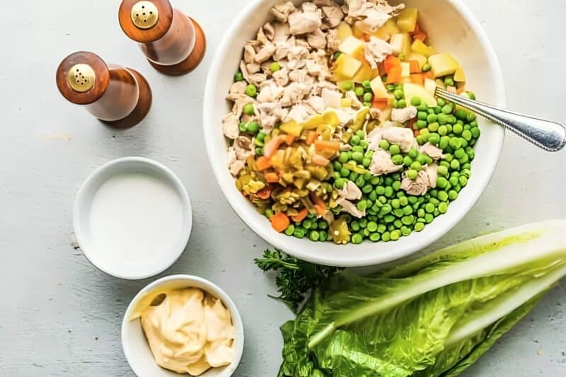 Chicken, potatoes, and veggies combined in a bowl.