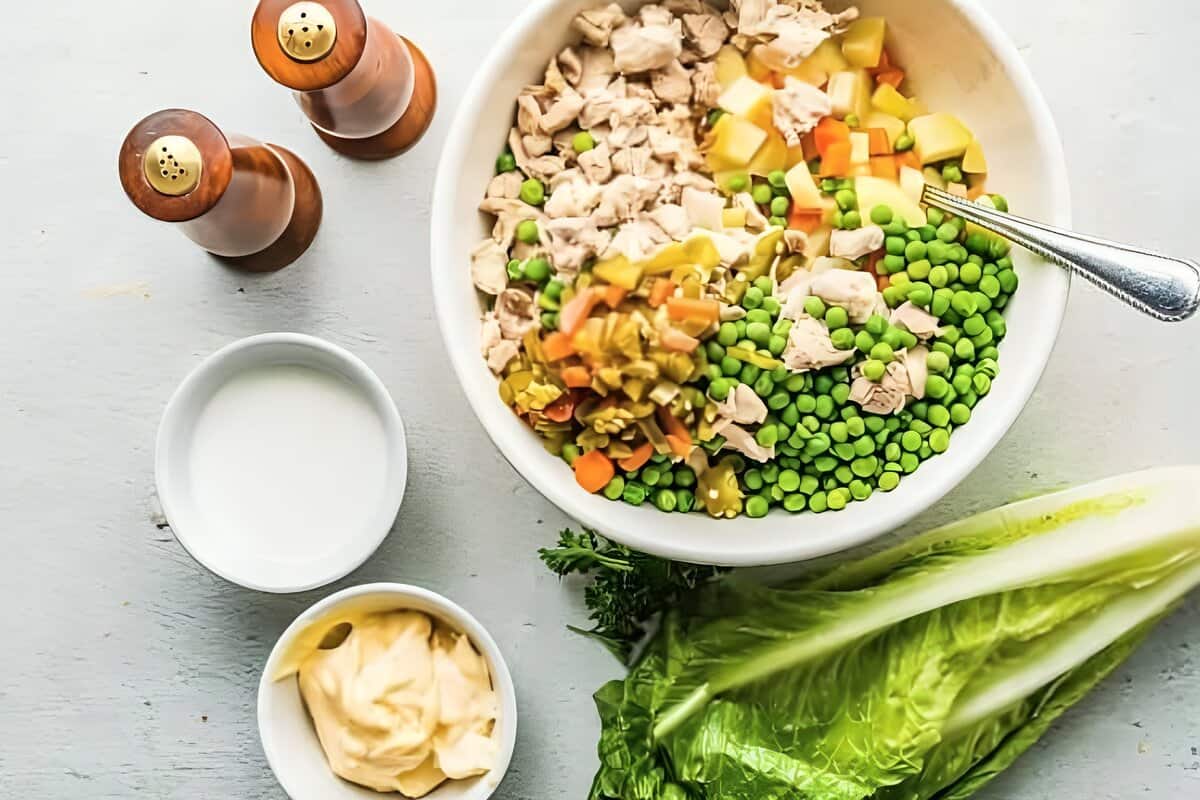 Chicken, potatoes, and veggies combined in a bowl.