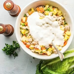 Chicken, potato, and veggie mixture topped with a creamy dressing.