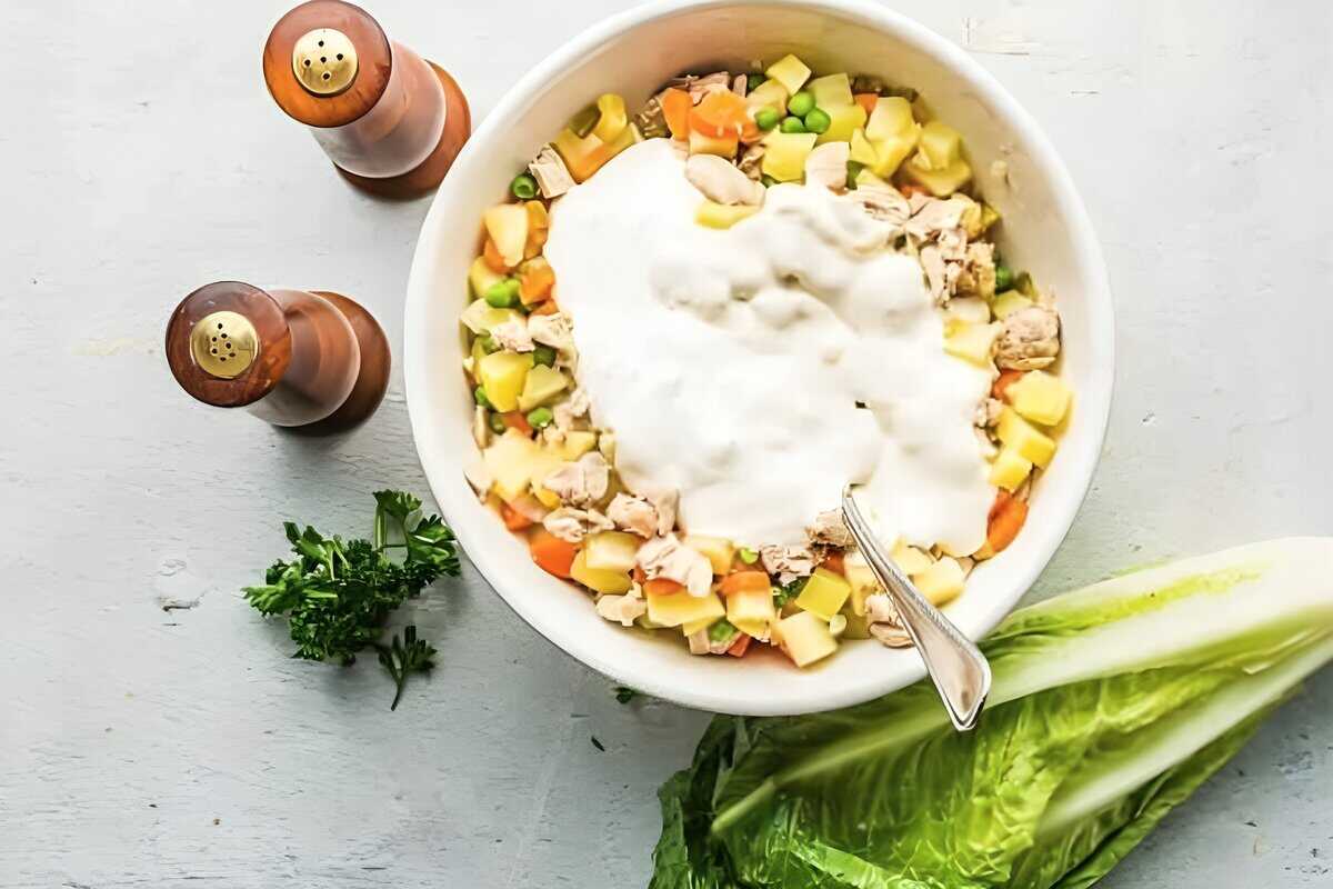 Chicken, potato, and veggie mixture topped with a creamy dressing.