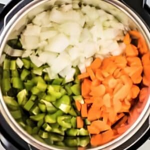 Chopped veggies added to an Instant Pot.