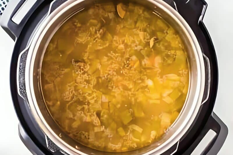 Soup ingredients added to an Instant Pot.