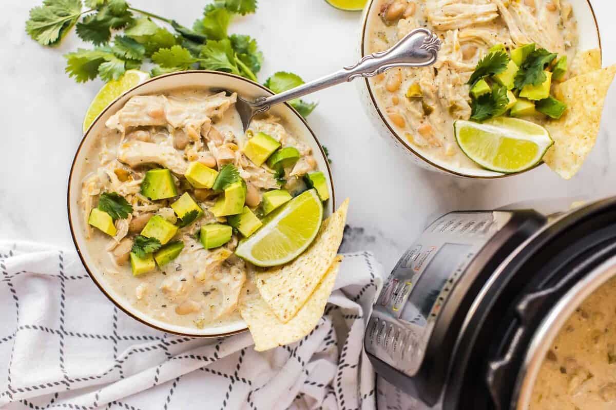 bowls of chicken chili garnished