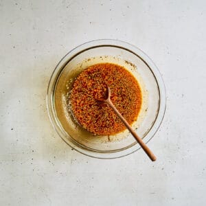 sauce in a glass bowl with a spoon.