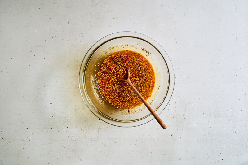 sauce in a glass bowl with a spoon.