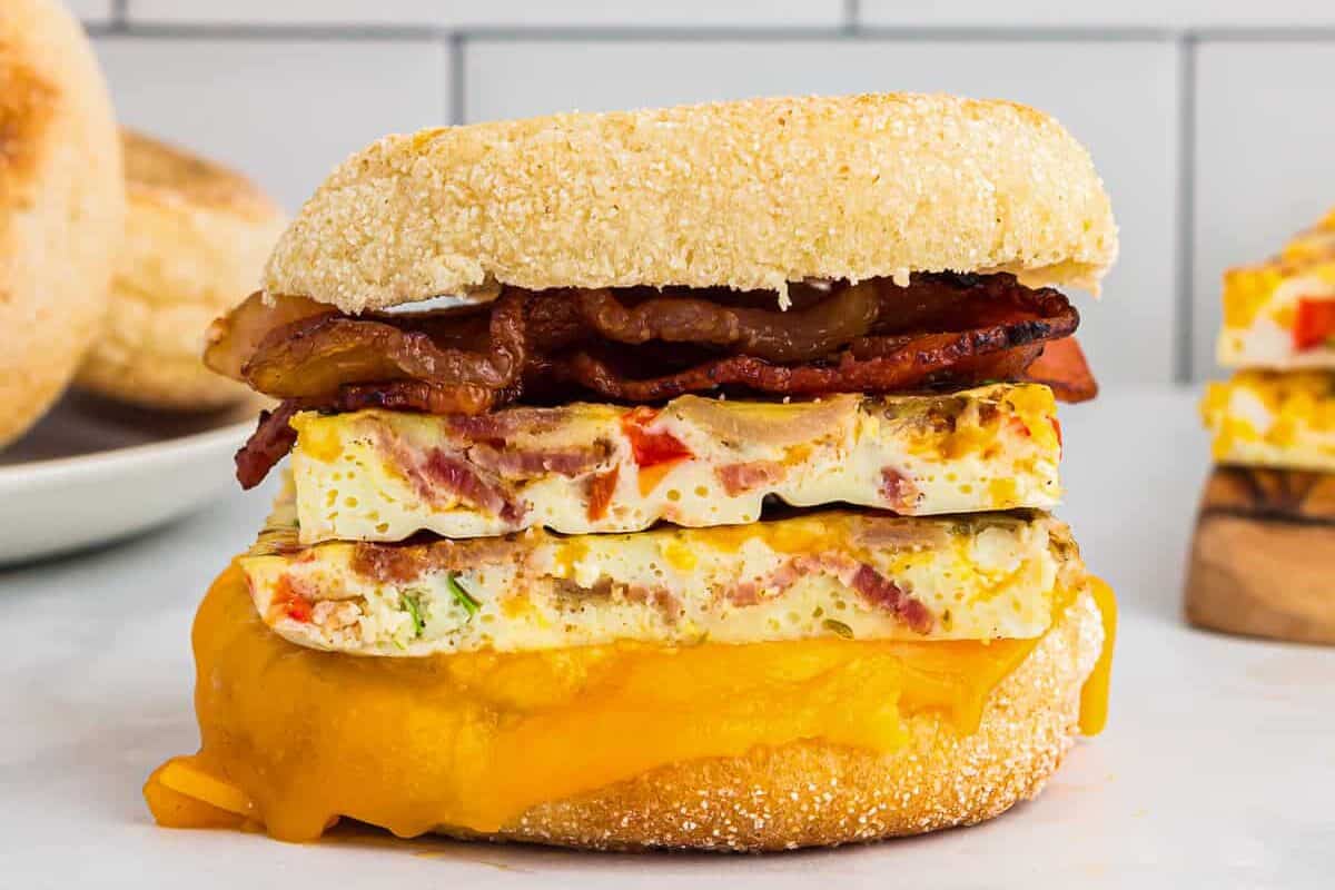 side view of 2 sheet pan eggs on an egg sandwich.