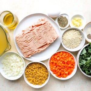 portioned ingredients for chicken meatball soup in individual containers.