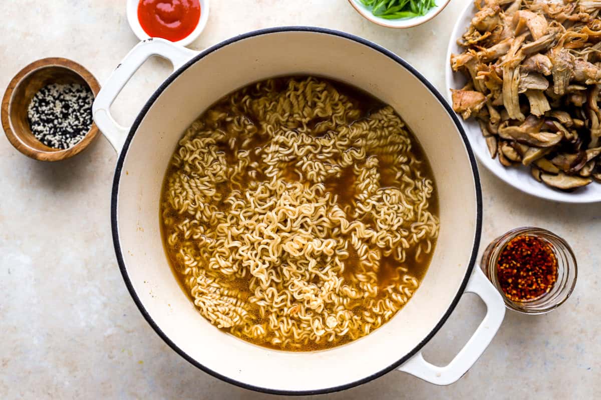 cooking instant ramen noodles in shoyu broth.