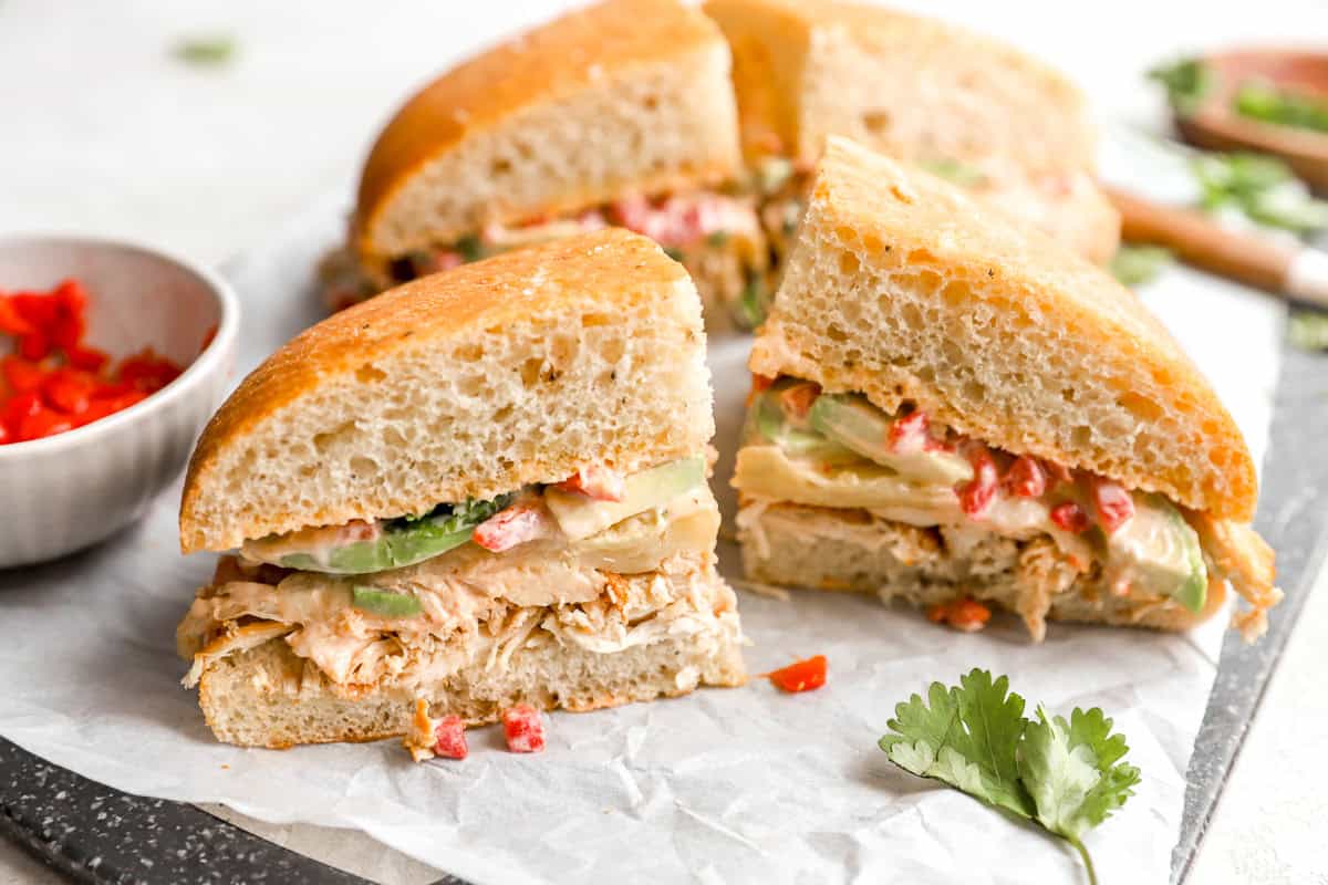 a chipotle chicken avocado melt cut into 4 pieces.