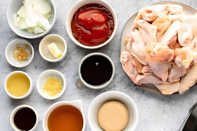 overhead view of ingredients for crockpot bourbon wings in individual containers.