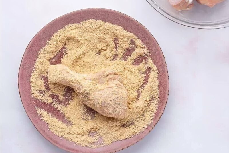 Chicken drumsticks coated in parmesan and herb mixture.
