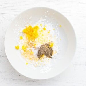 lemon pepper dredge ingredients in a white bowl.