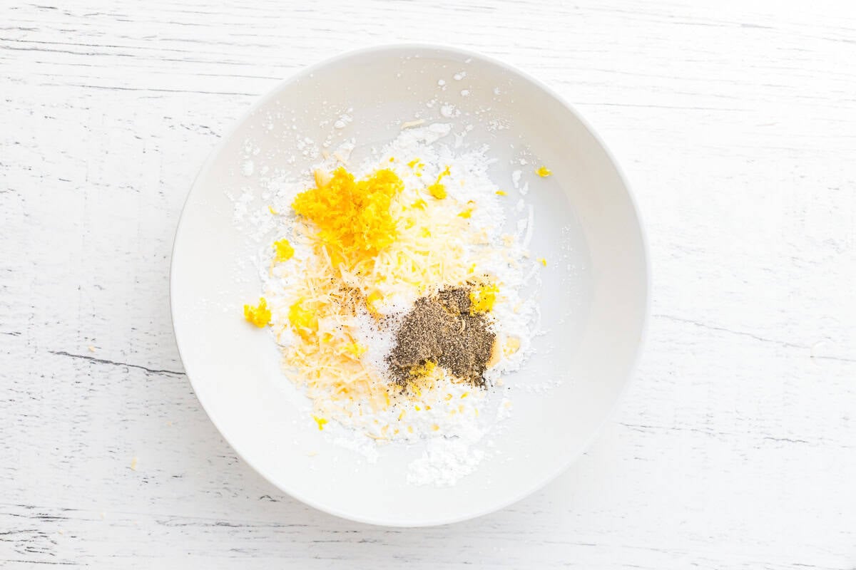 lemon pepper dredge ingredients in a white bowl.