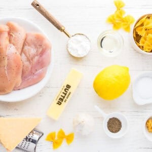 portioned ingredients for lemon chicken pasta in individual containers.